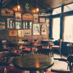 round wooden cafeteria tables and chairs inside room