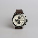 round silver-colored Fossil chronograph watch at 9:22 with brown leather band